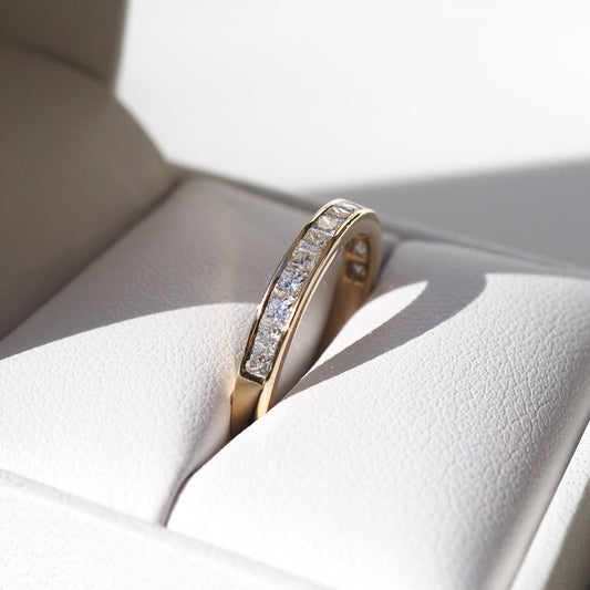 Channel Wedding Band Featuring 0.90 TCW Princess Moissanite