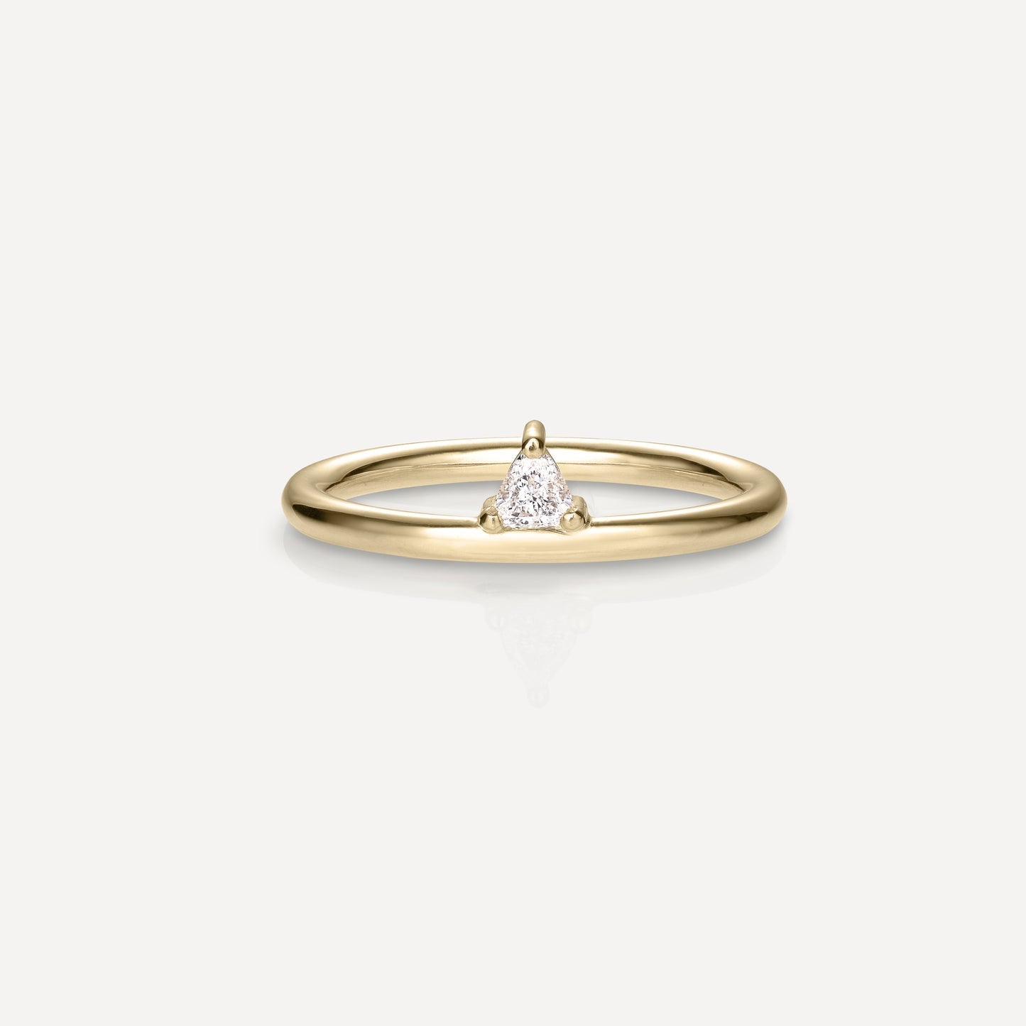 Offset Solitaire Engagement Ring Featuring 0.15 CT Trillion Moissanite